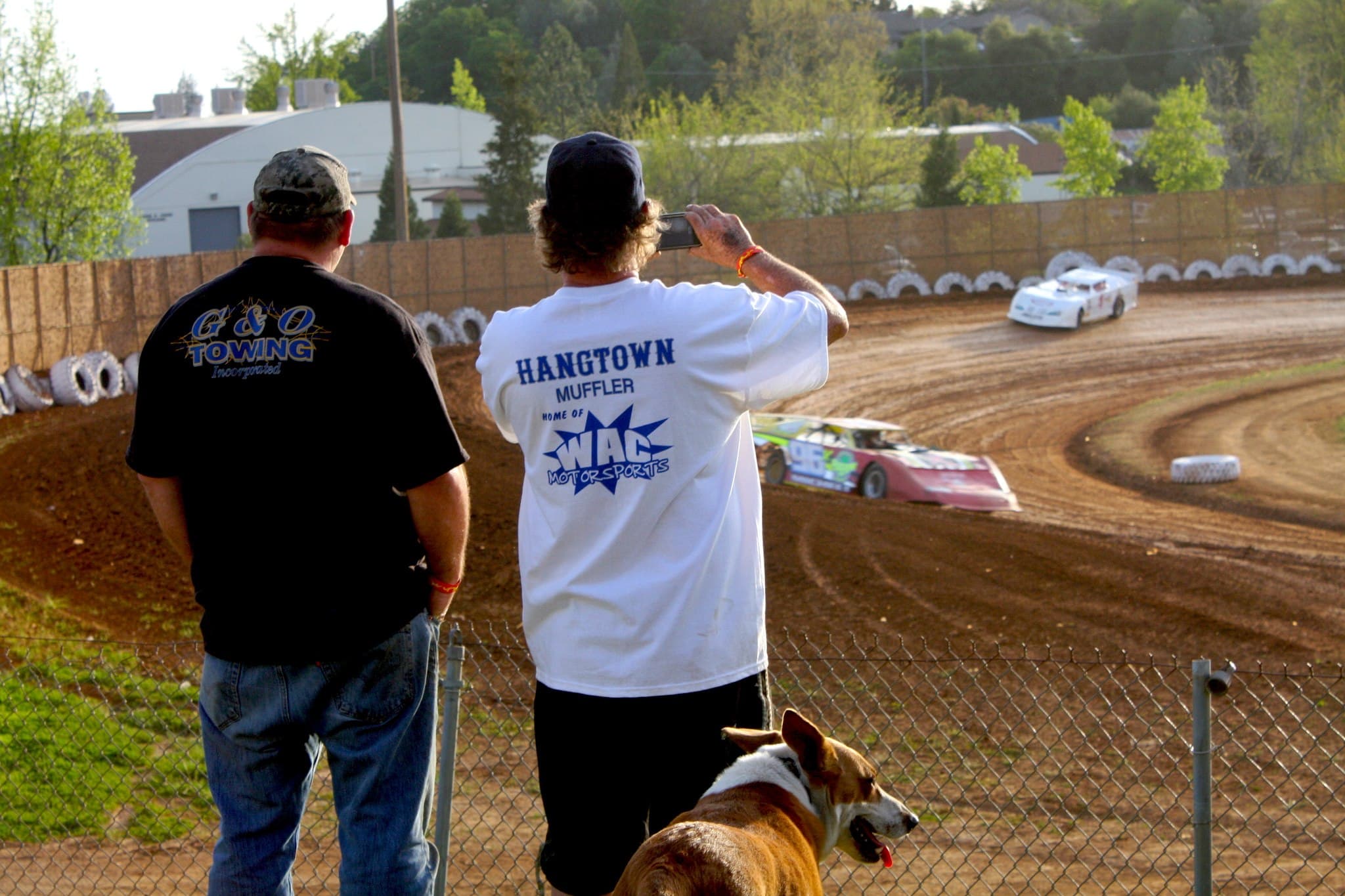 Bryan Carnett watching the racing from behind the trackside fence